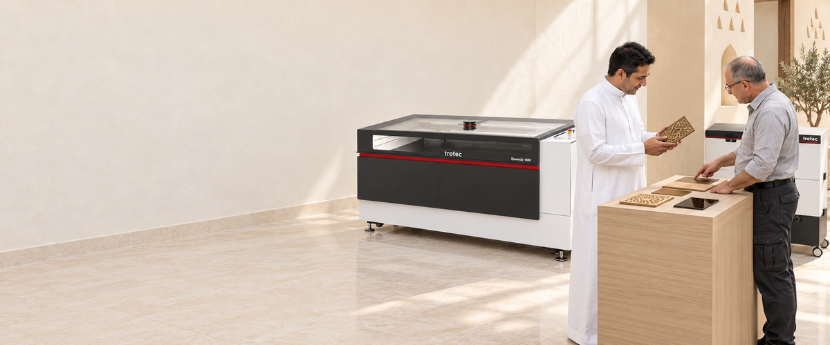A Lawazen specialist demonstrating laser-cut samples to a client in the Riyadh showroom
